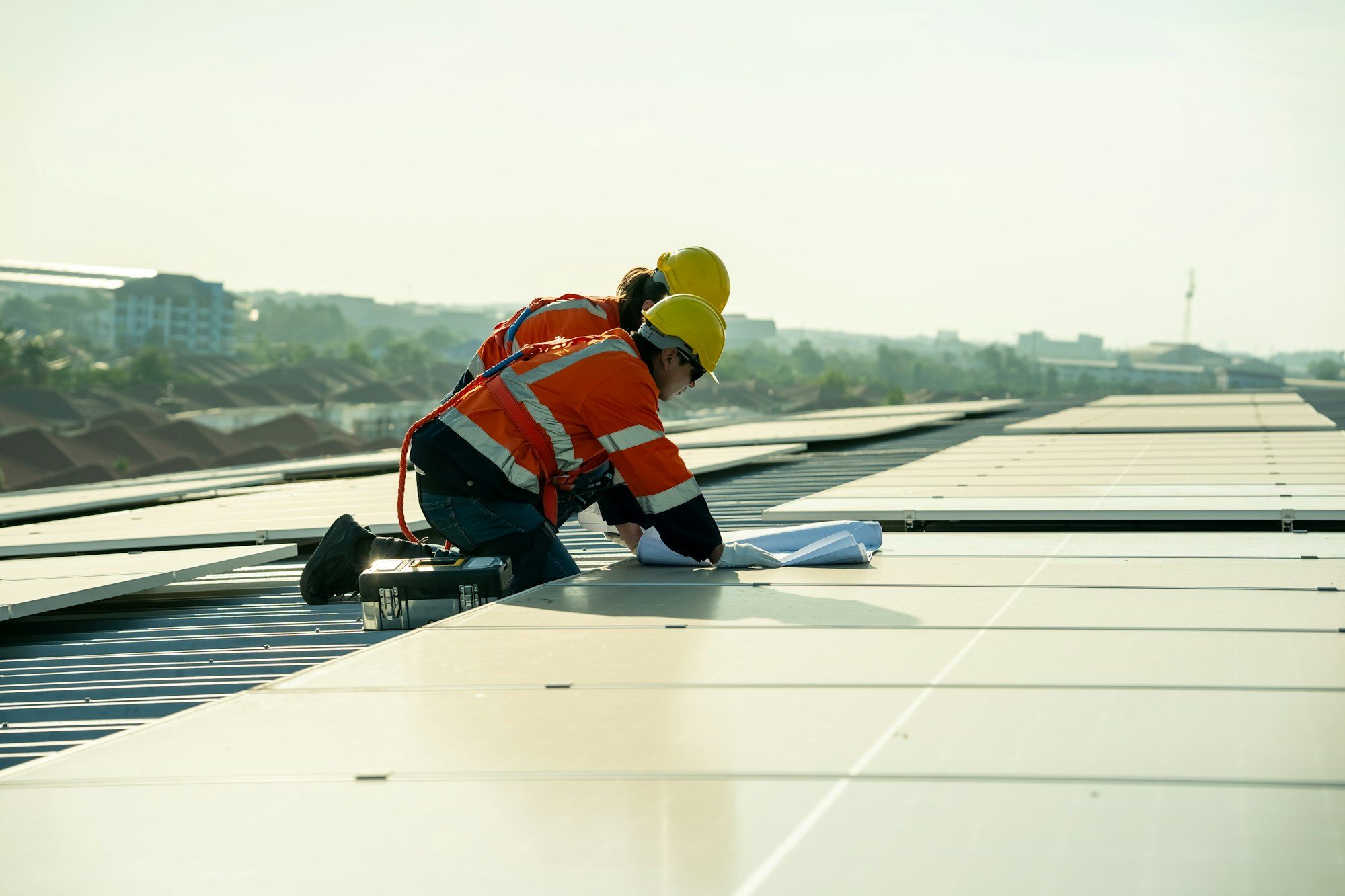 Engineer working setup Solar panel at the roof top. Engineer or worker work on solar panels or solar