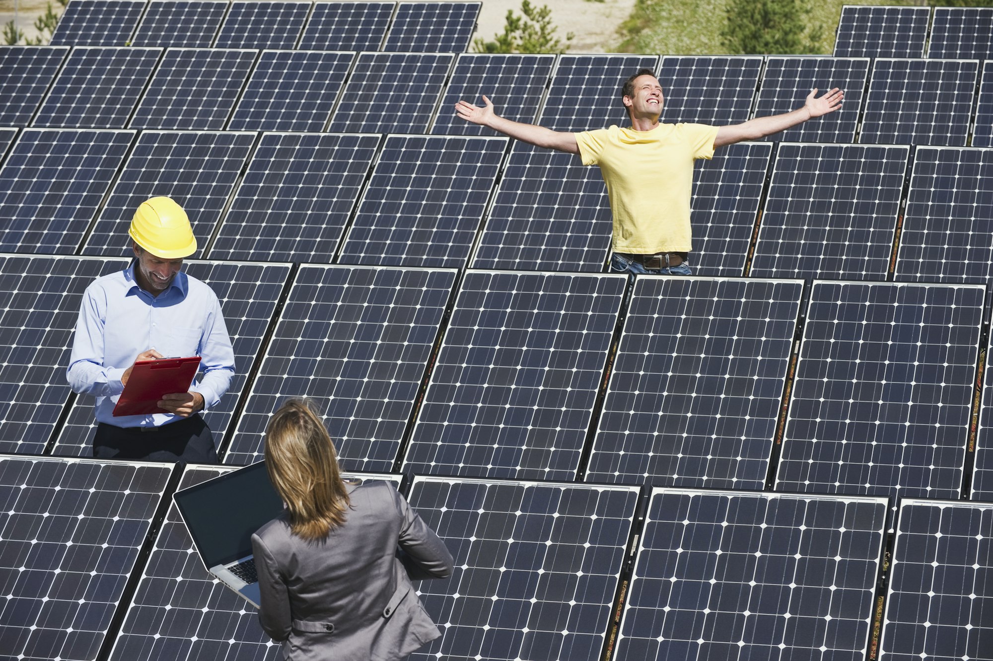 Germany, Munich, Engineer with man and woman in solar plant